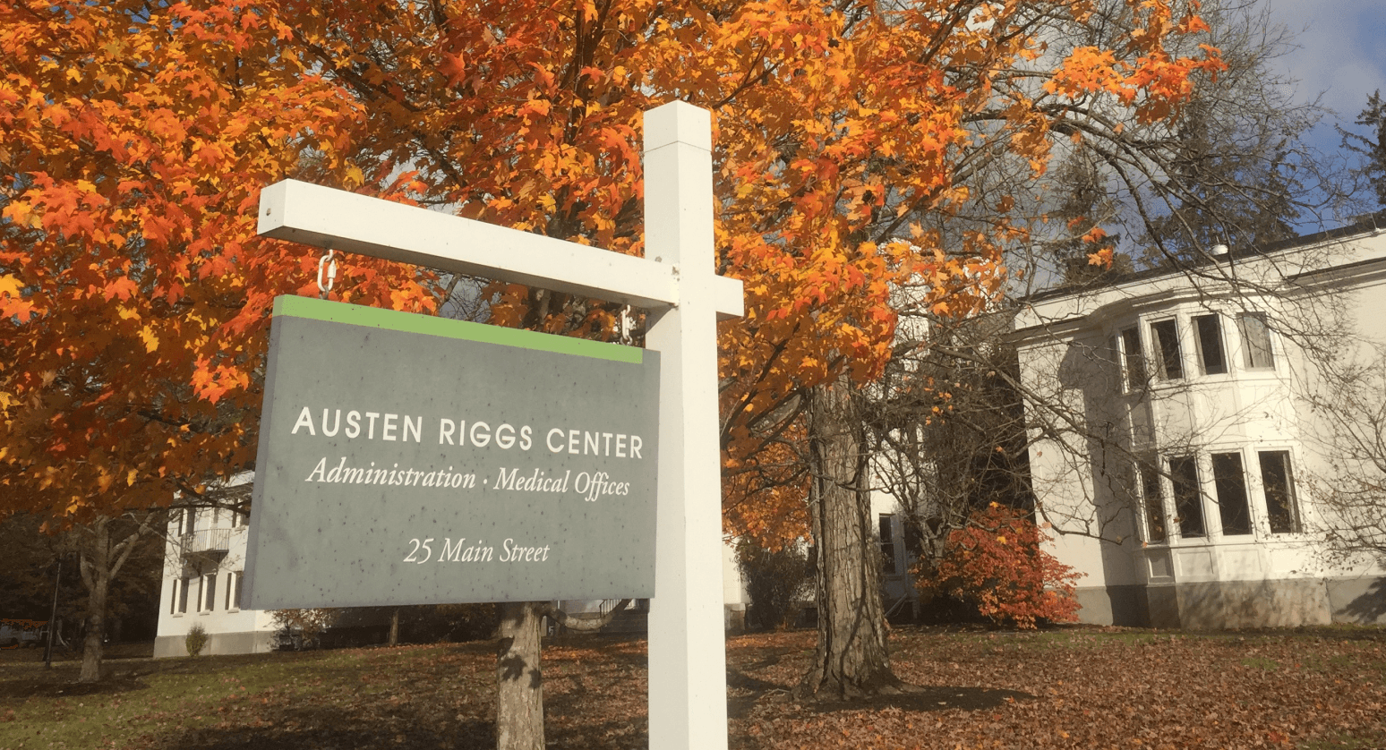 Sign outside Riggs offices on a fall day